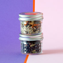 Load image into Gallery viewer, Two jars of botanicals set of top of each other. G&amp;T mix on the bottom and Infusion mix on top.
