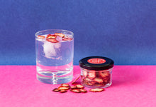 Load image into Gallery viewer, A jar of dehydrated strawberries and a g&amp;t with strawberry garnish
