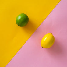 Load image into Gallery viewer, lime on a yellow background and lemon on pink background arranged on an angle.
